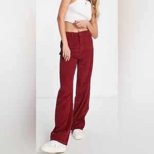 Mid rise, wide leg slouchy corduroy pants in burgundy